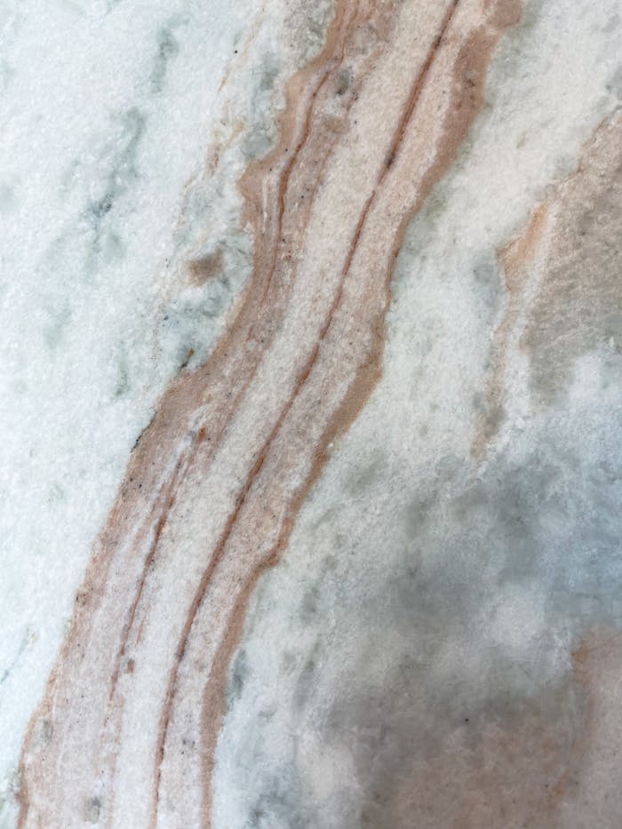 Detailed close-up of natural marble texture showing unique patterns and colors.